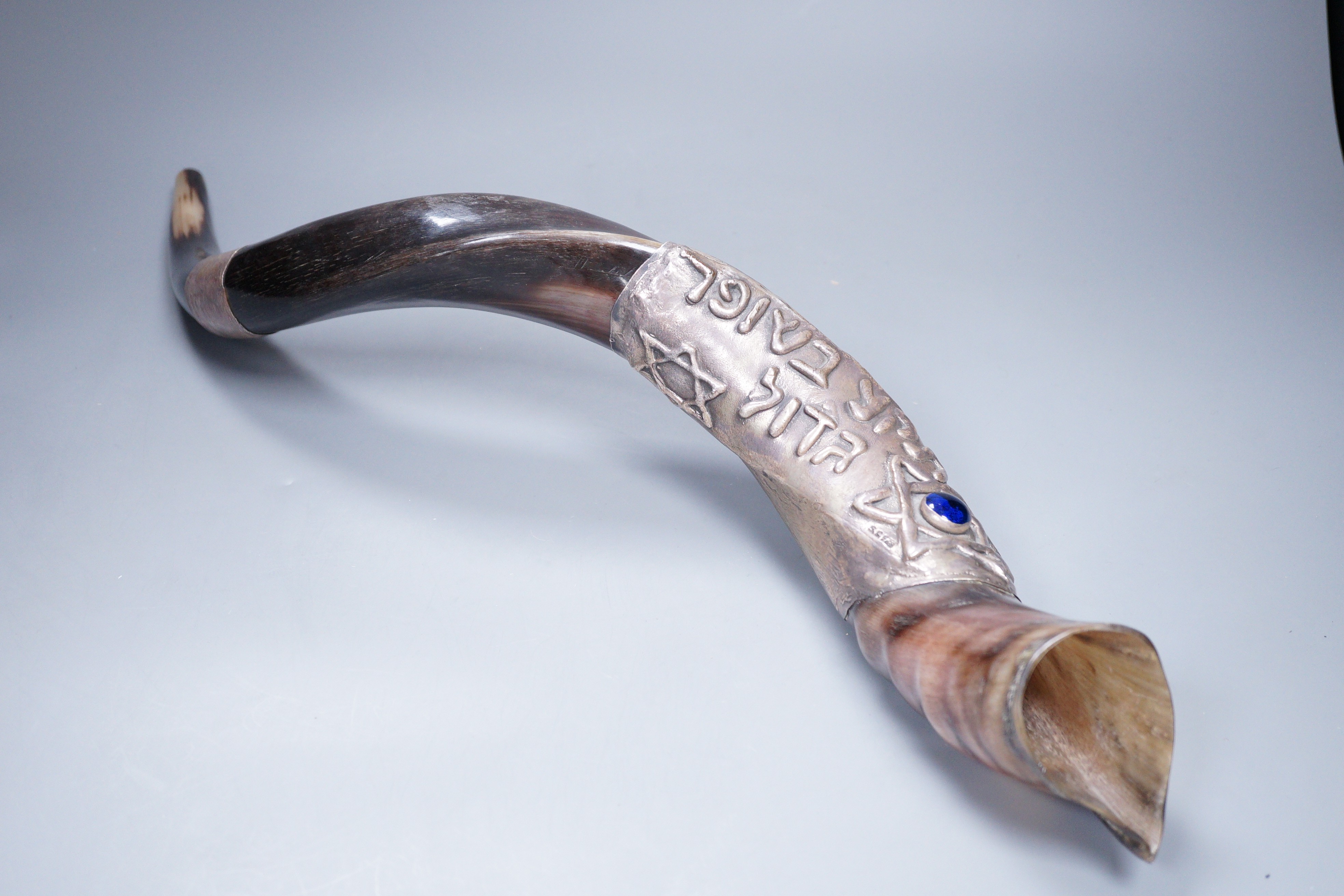 An Israeli white metal mounted horn shofar, stamped 925, 59cm